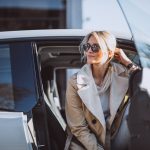 Woman sitting in electo car
