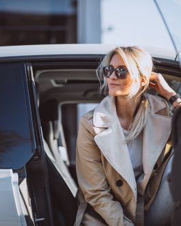 Woman sitting in electo car